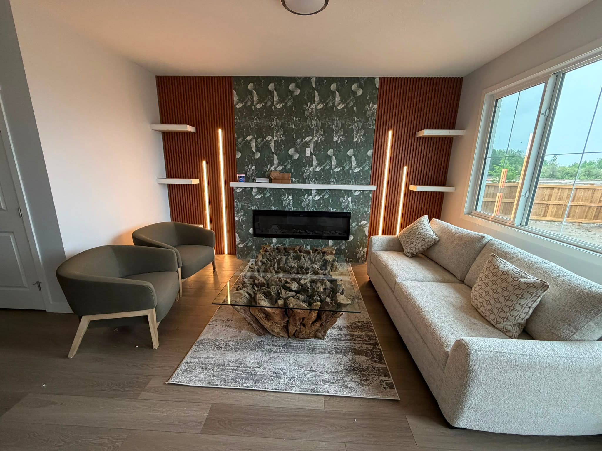 Finished living room renovation with fireplace and feature wall